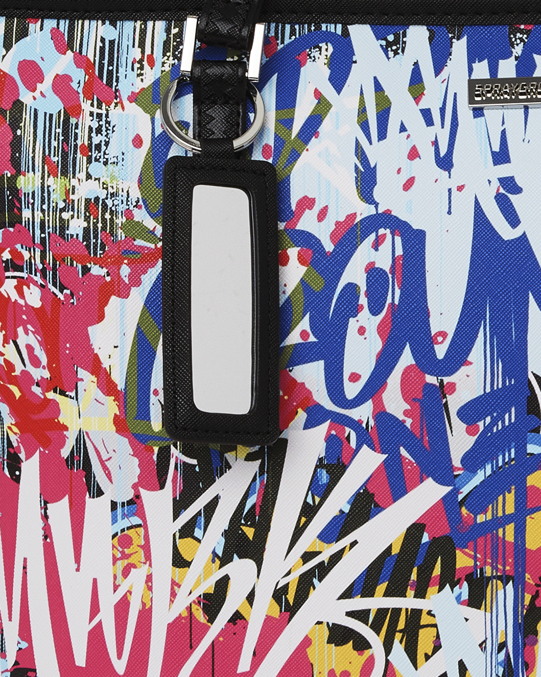 Front view of the vibrant Sprayground tote with animal print design.