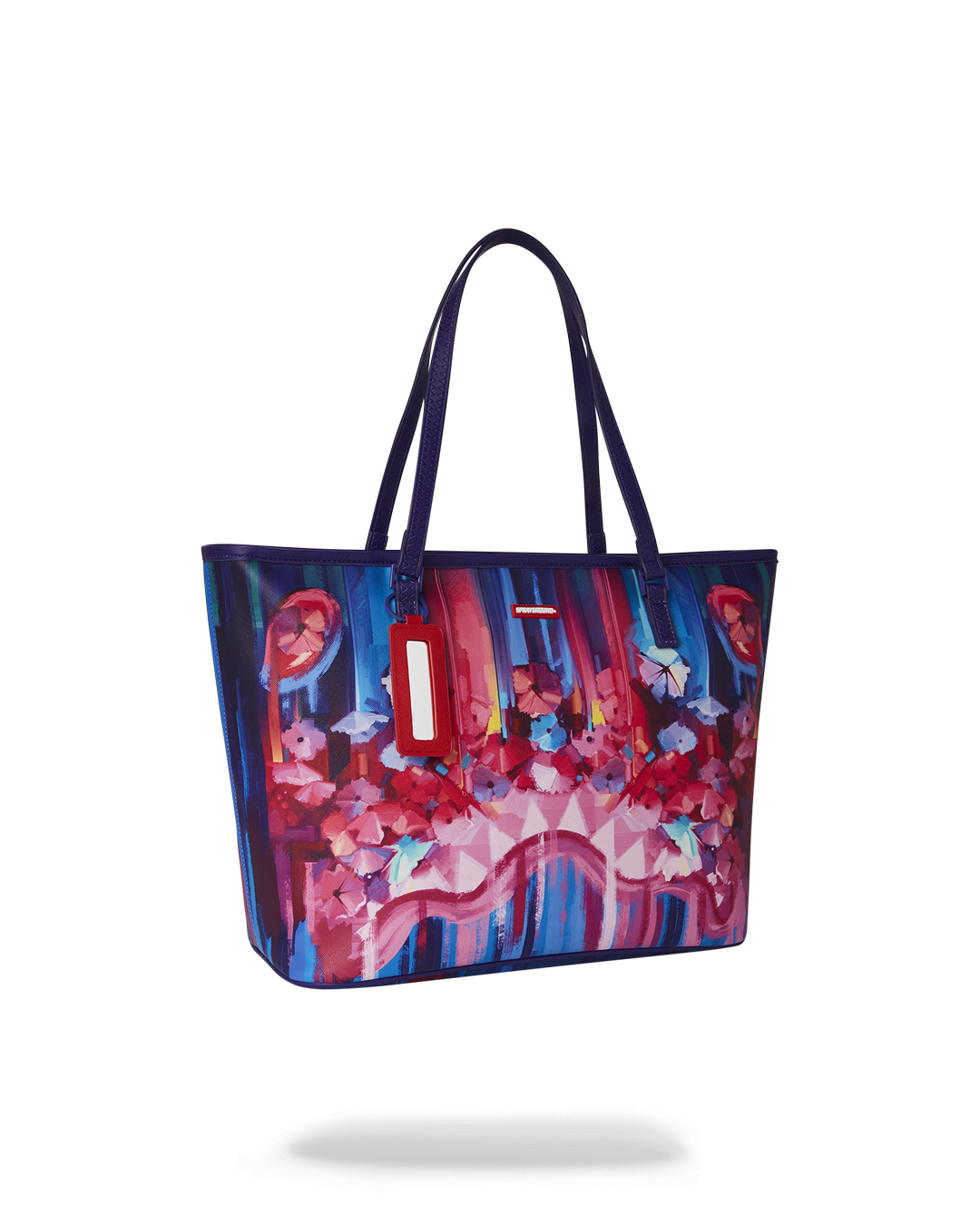 Tote interior with pockets, styled with a laptop and notebook
