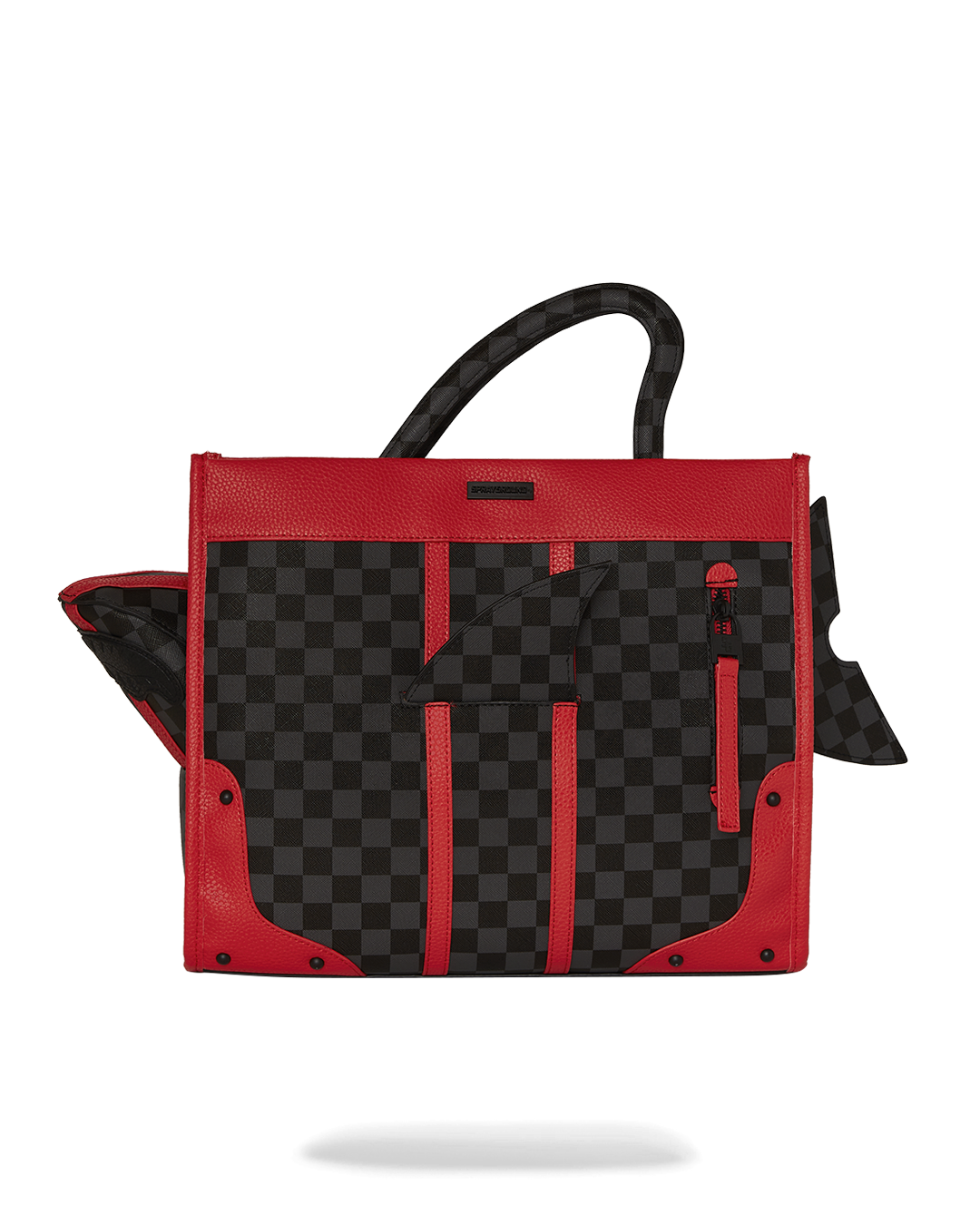 Shark print tote bag held over the shoulder in a city setting