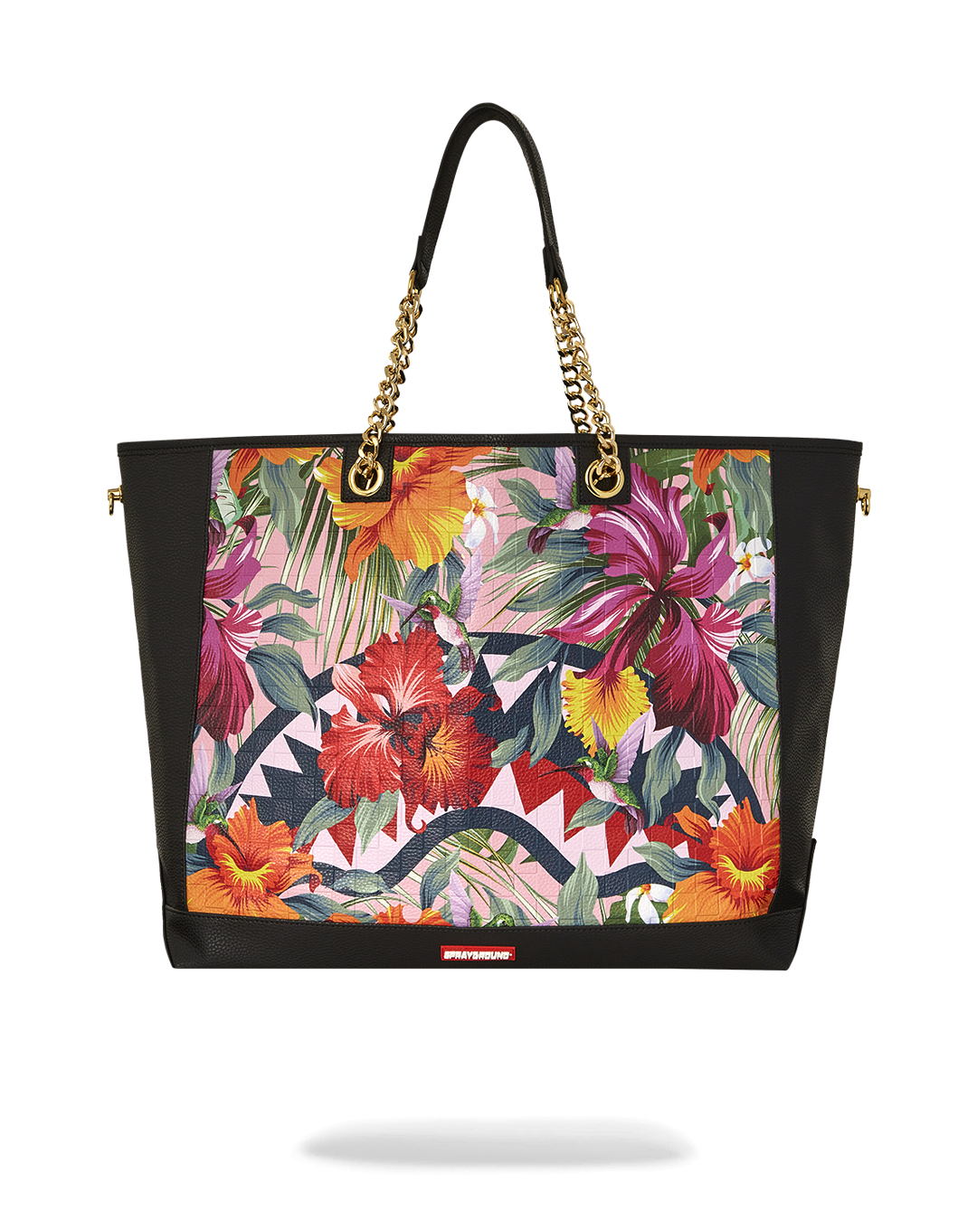 Front view of Sprayground shark-print faux leather tote bag on a city sidewalk
