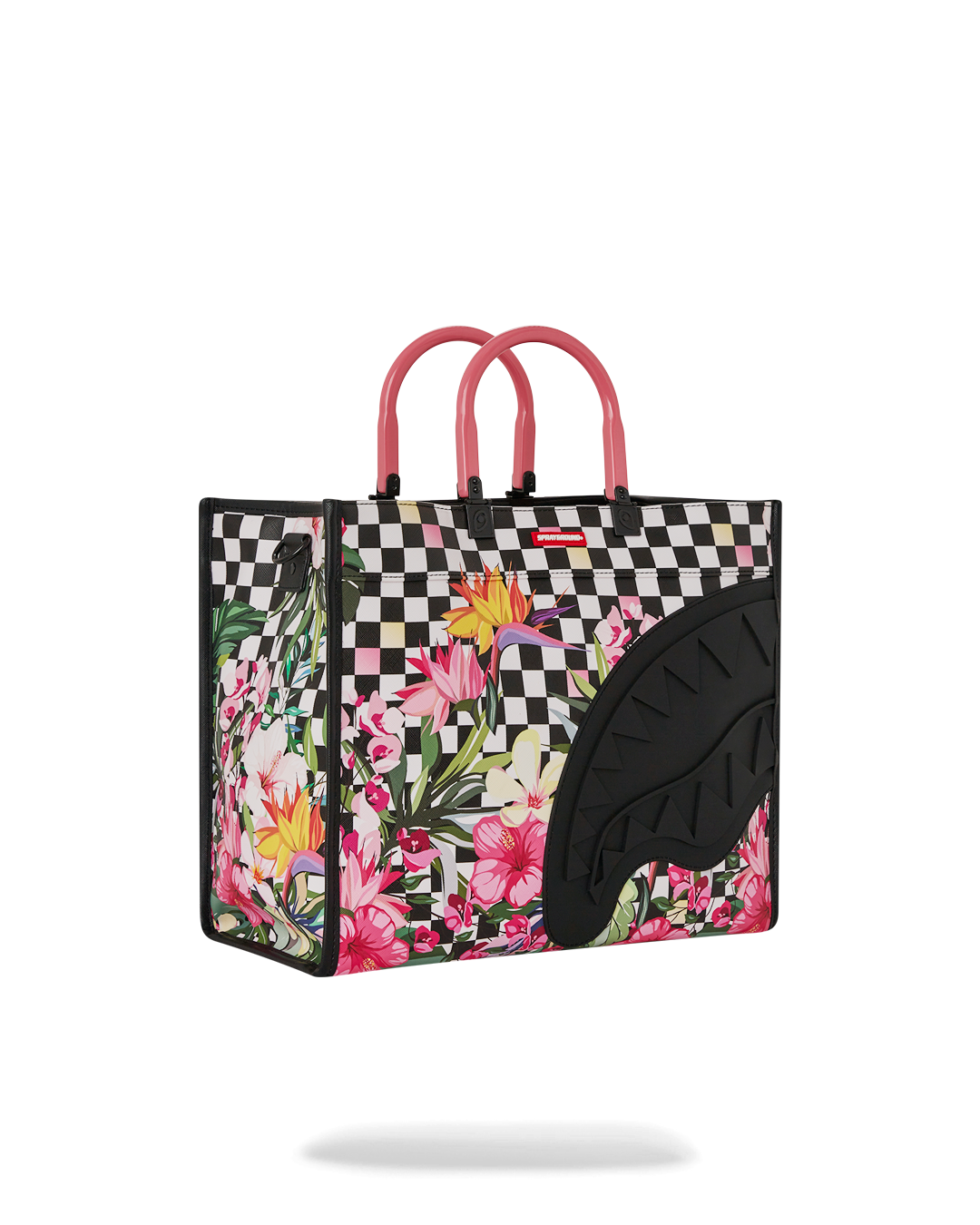 Interior of the tote bag with laptop and essentials packed for a weekend trip