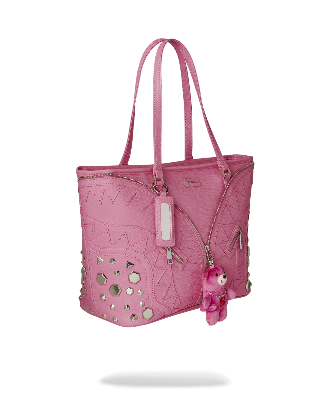 Leopard print bag tote with silver metal studs on the side panels and a hanging mirror keychain.