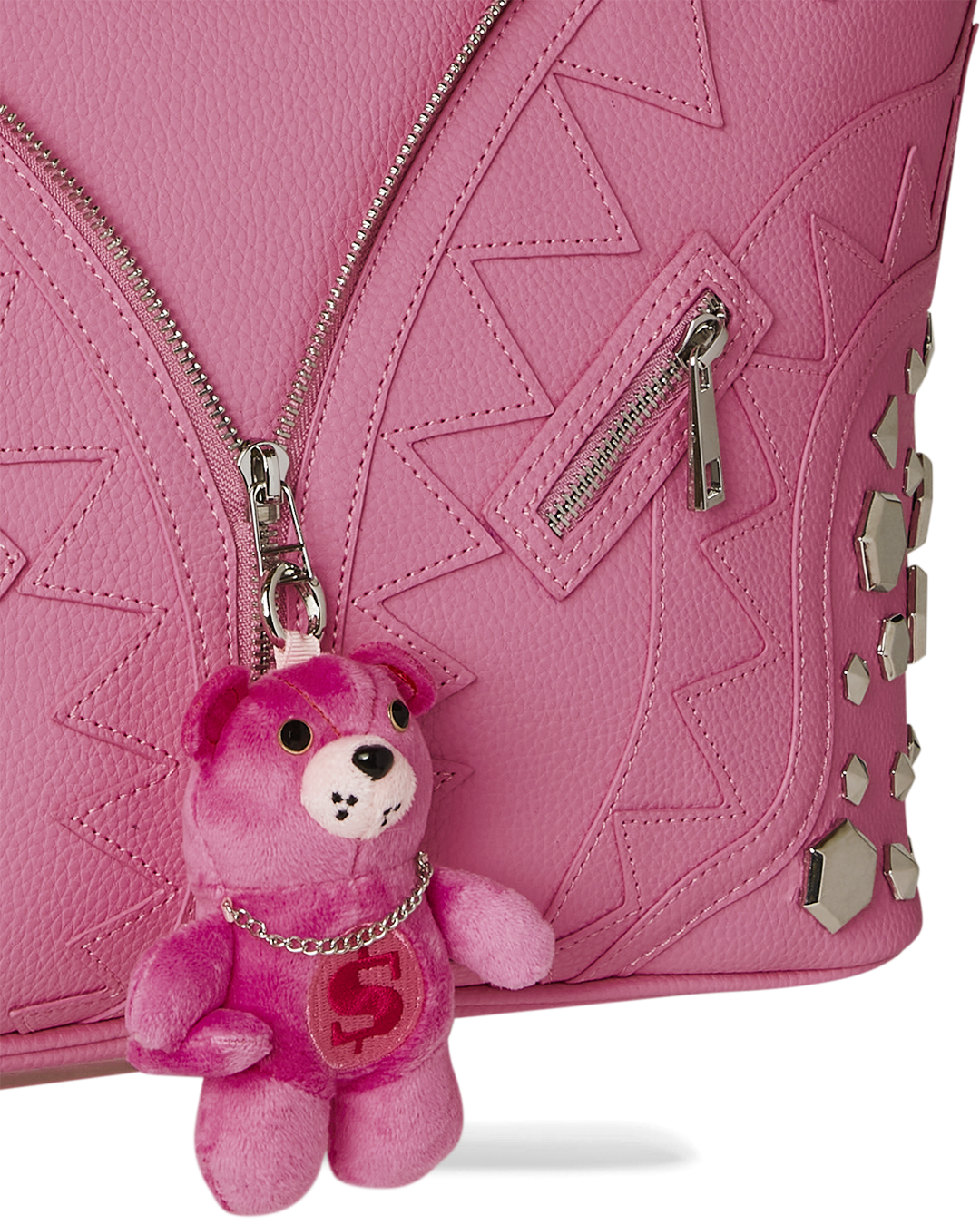 Sprayground leopard print tote bag with faux leather construction and decorative zipper details.