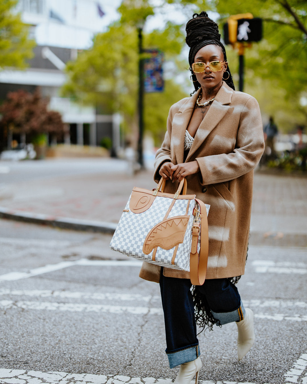 Henny Latte tote bag worn crossbody with laptop inside