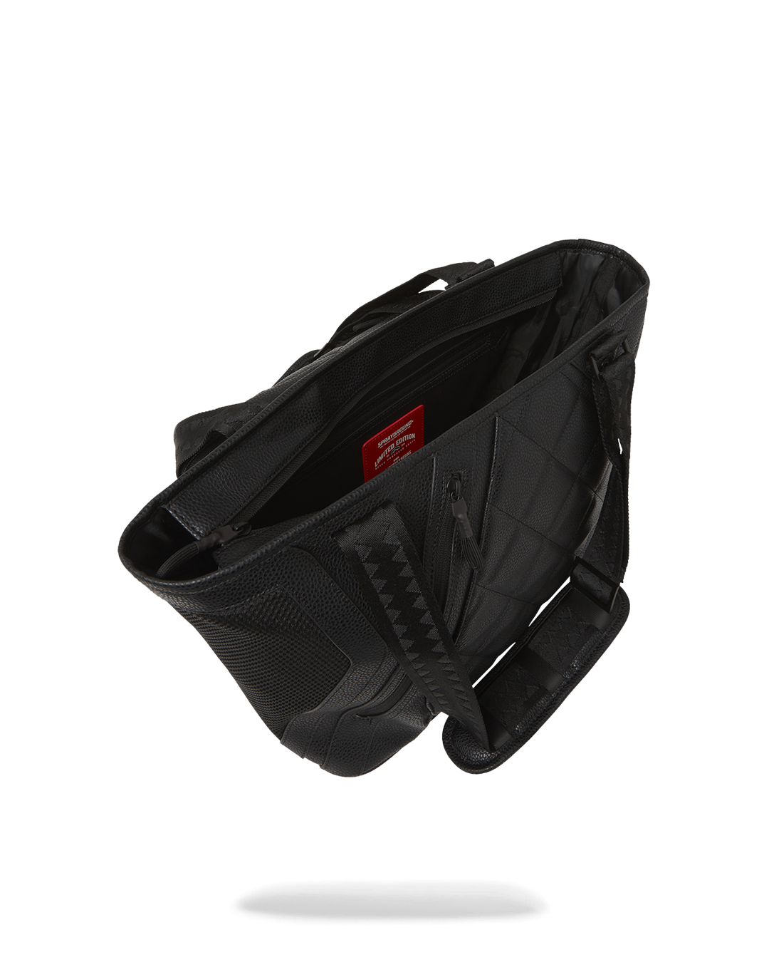 Interior view of the Sprayground tote showing cargo pockets.