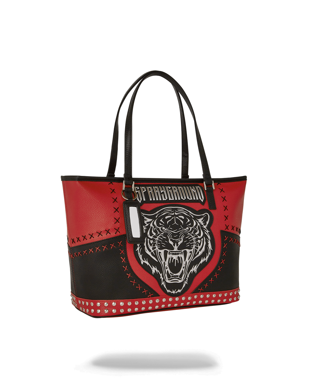 Woman carrying the Sprayground tote bag in an urban setting