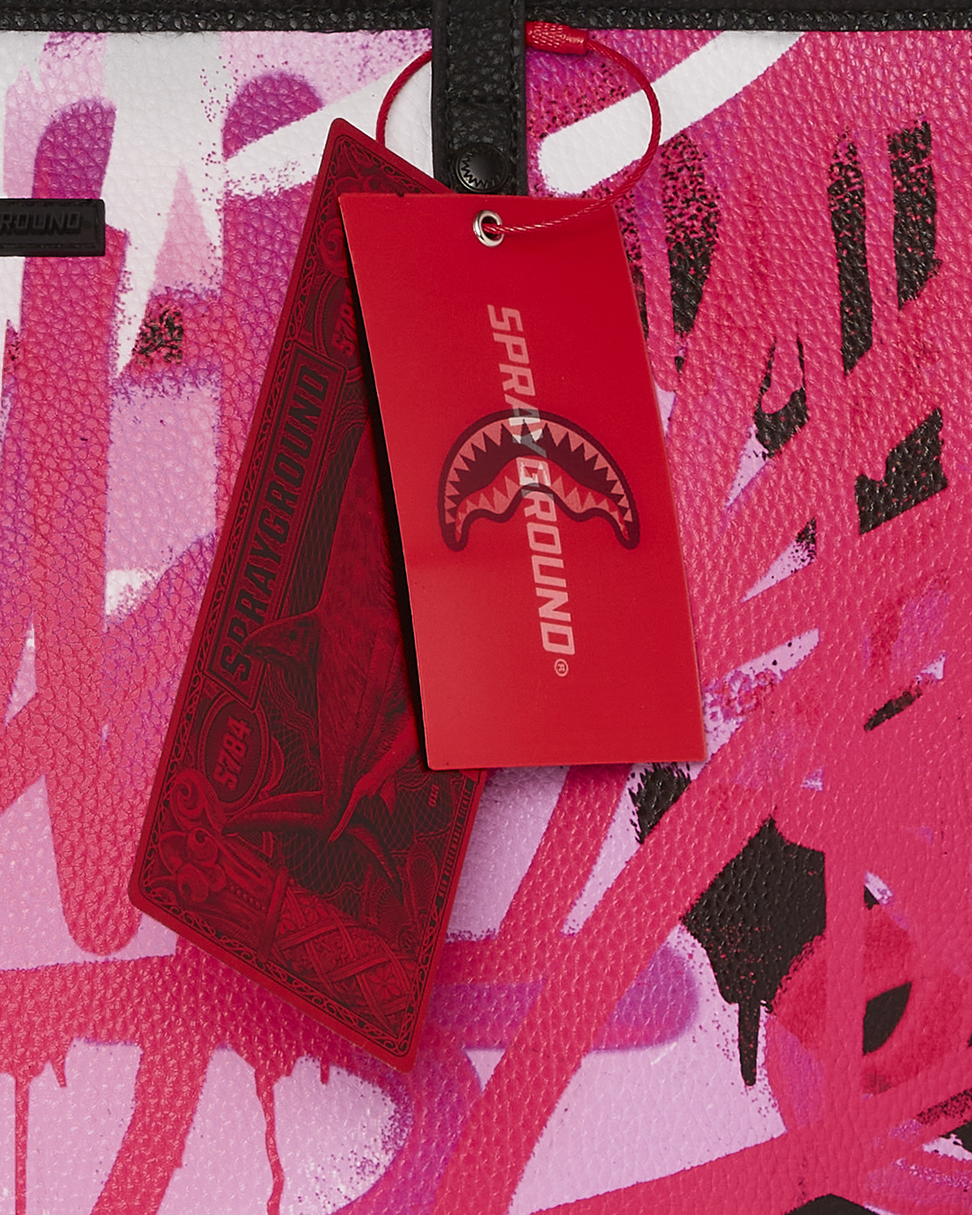 Side view of SkyGlow Wing faux leather tote bag showcasing its stylish design.
