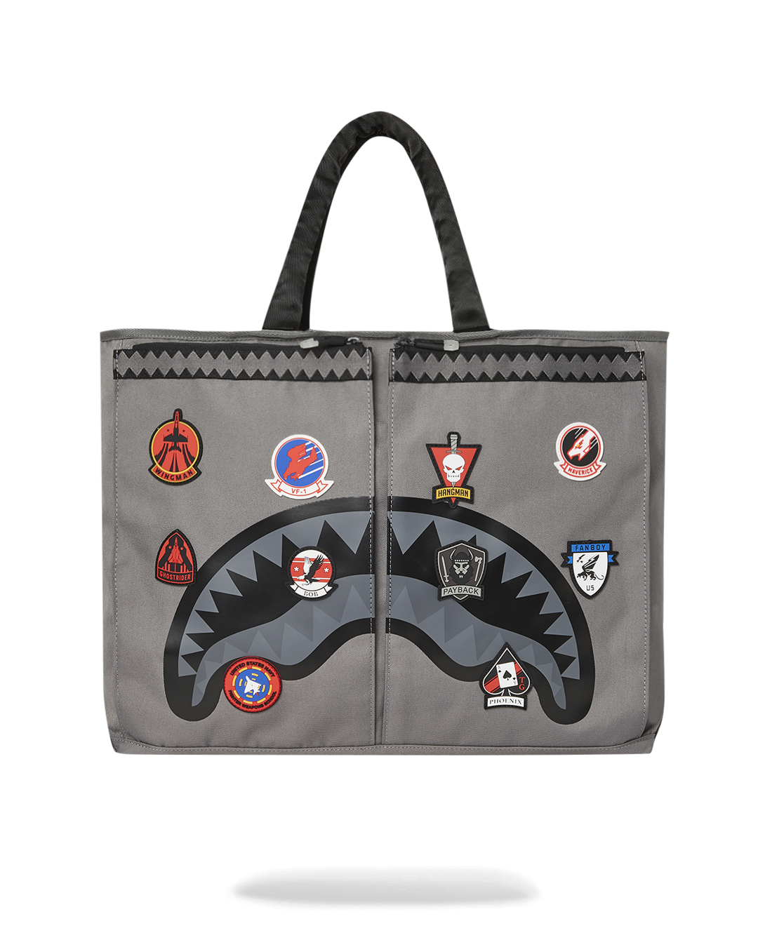 Front view of the designer tote showing rubber patches and airplane zipper detail