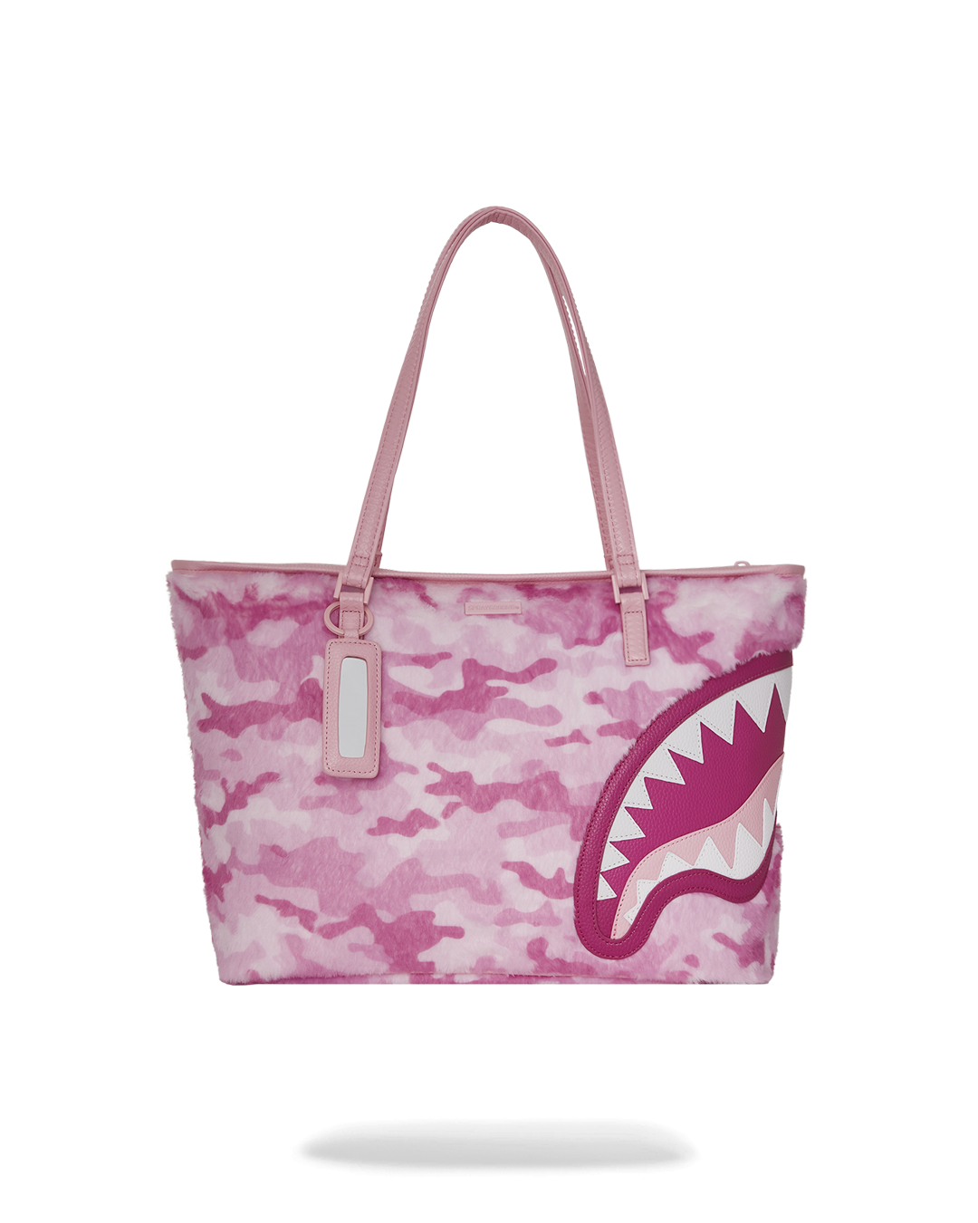 Chic pink Goyard tote bag showcasing spacious interior and stylish design.