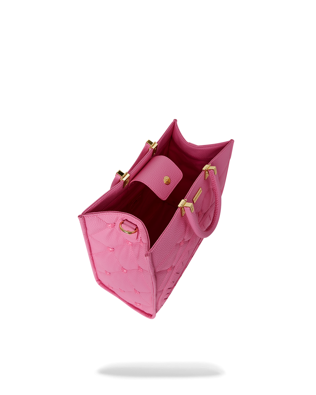 Side angle showing faux tortoise handles and removable cross-body strap