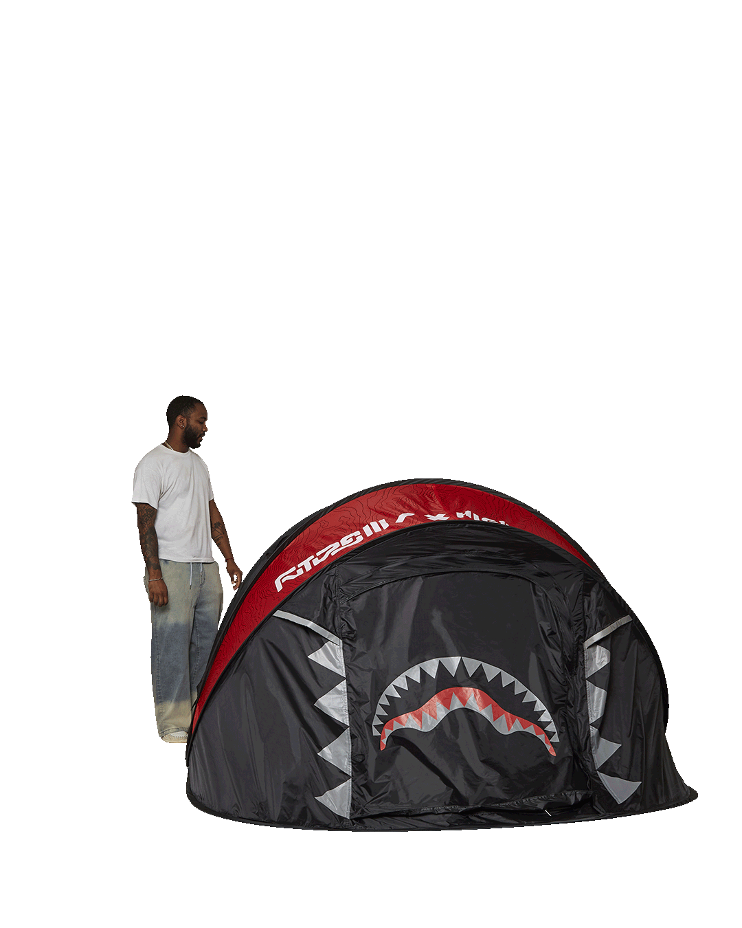 Tent interior showing queen-sized air mattress with mesh windows