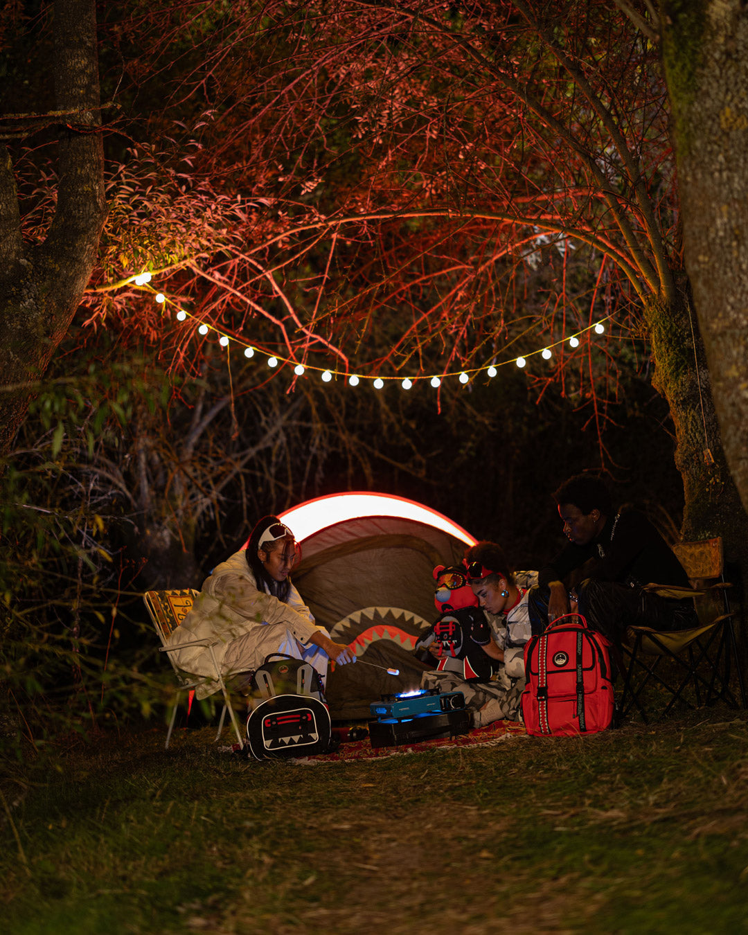 Tent interior showing queen-sized air mattress with mesh windows