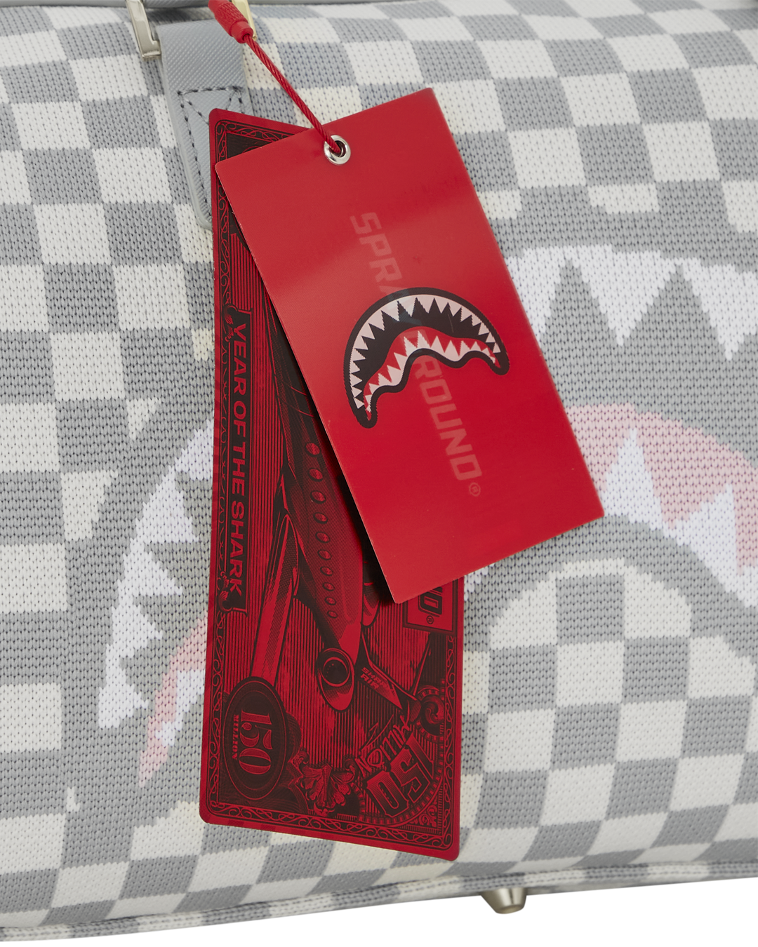 Close-up of the sharkmouth detail on the black crossbody bag-inspired design
