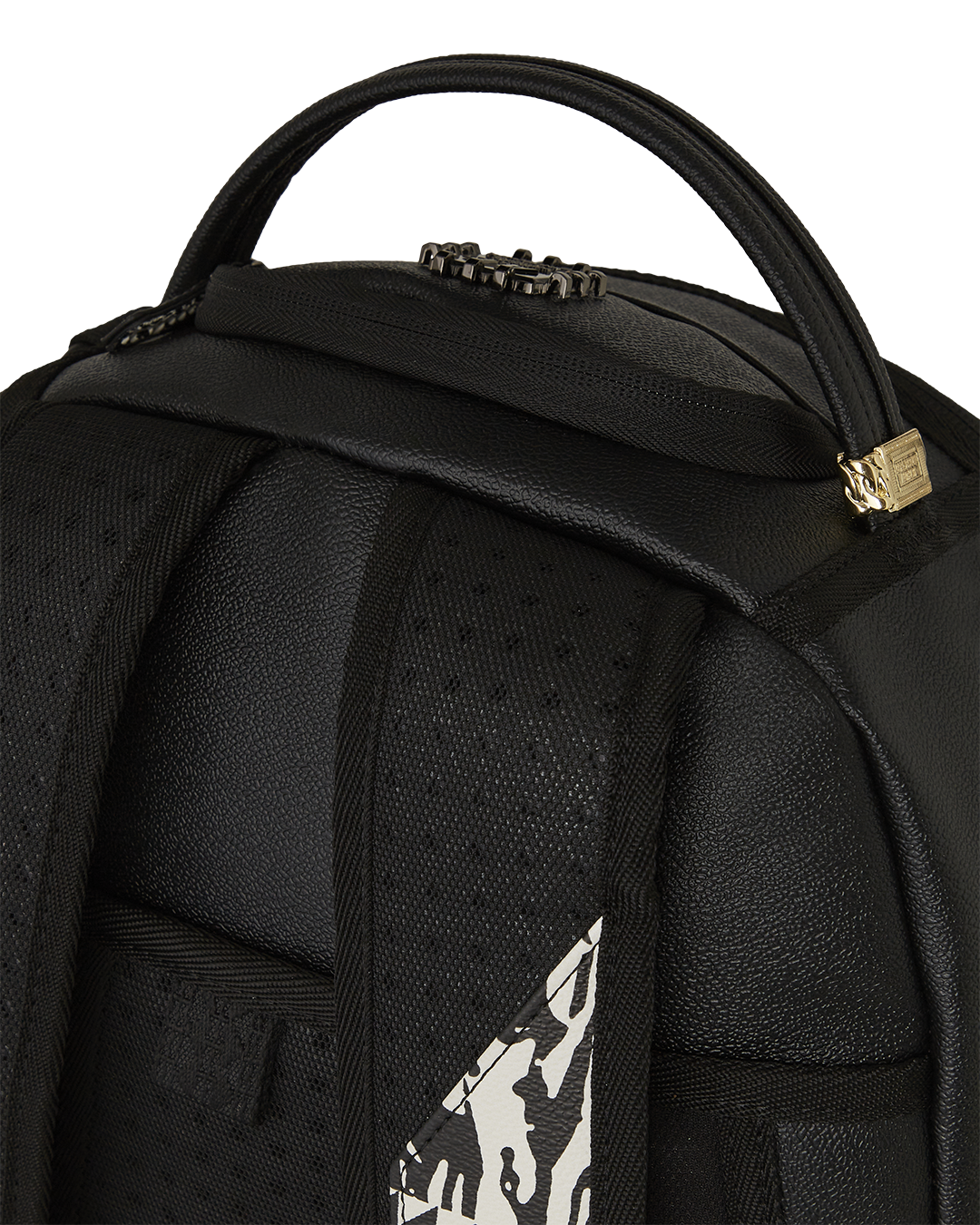 Close-up of the limited edition Sprayground backpack showcasing gold zippers and faux leather material