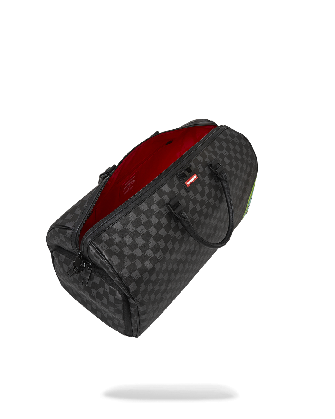 Open duffle bag with sneaker pocket visible, packed for a weekend trip