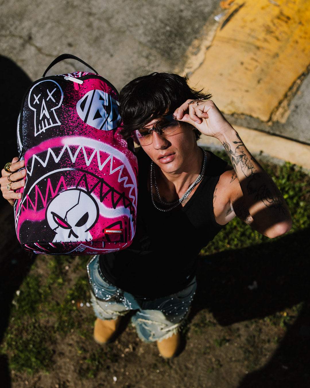 Peak Design Backpack DLXR being worn, demonstrating its ergonomic mesh back padding and adjustable straps.