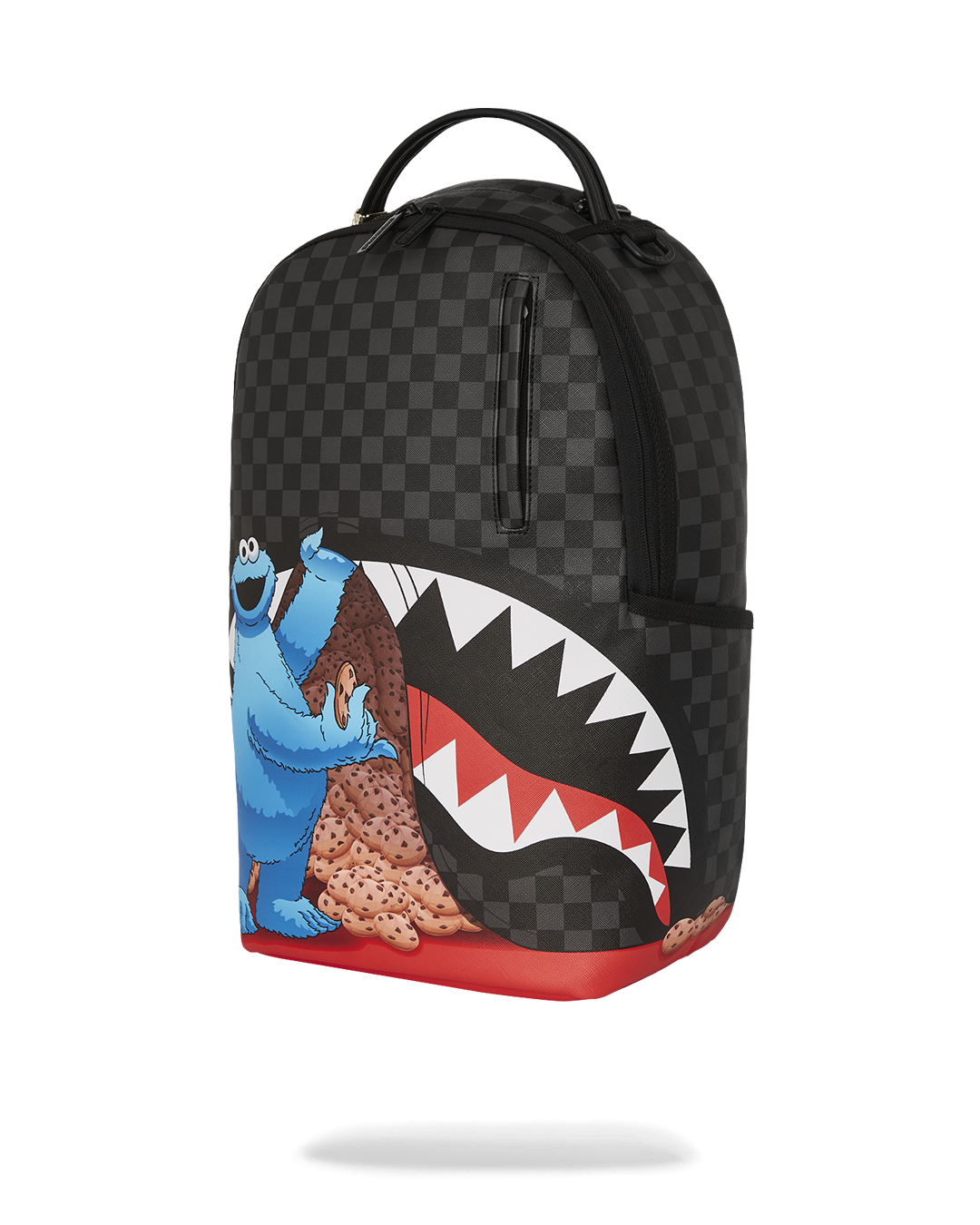 Interior of the Cookie Monster backpack with laptop compartment and mesh organizer.