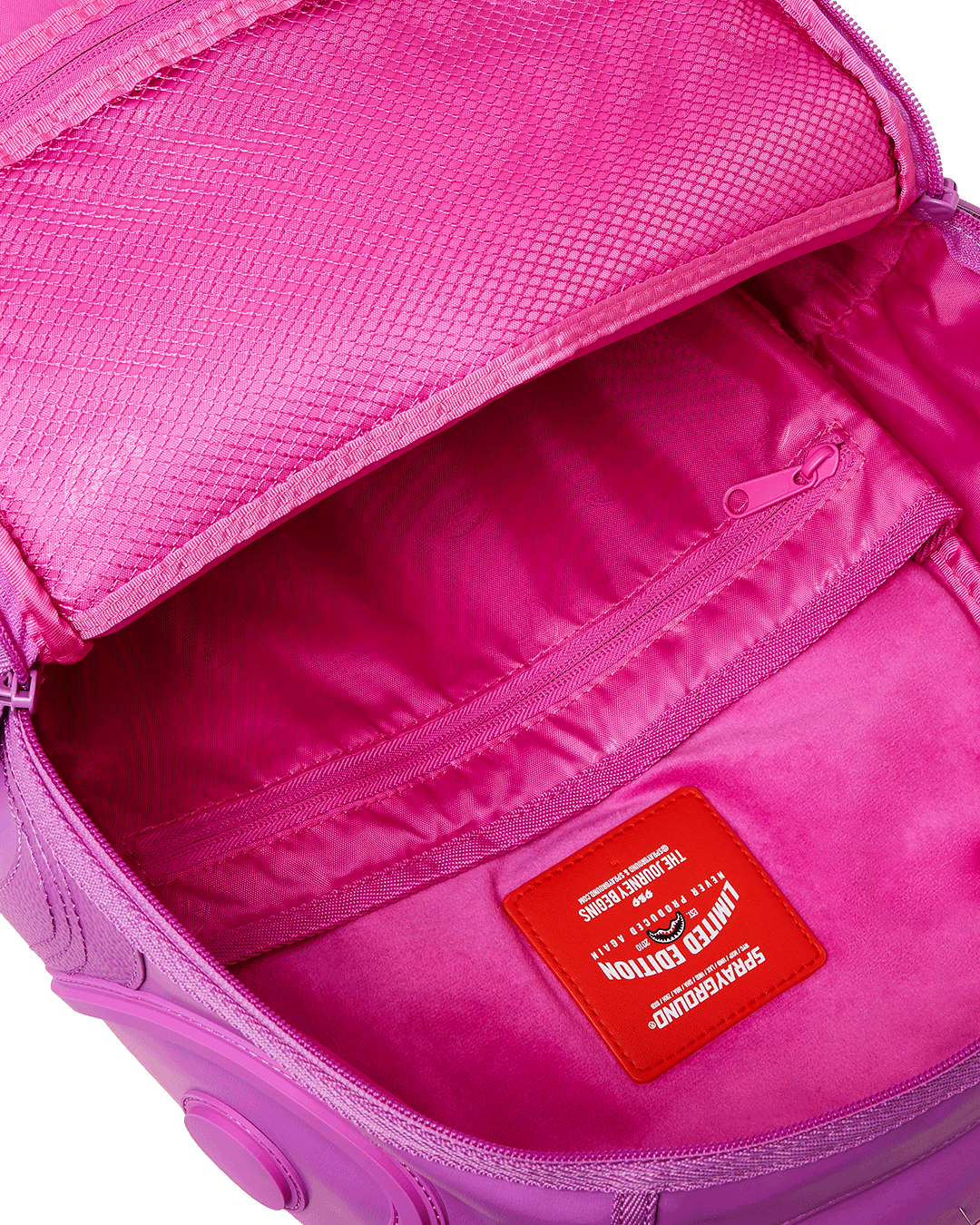 Backpack open showing velour laptop compartment and organizer pockets