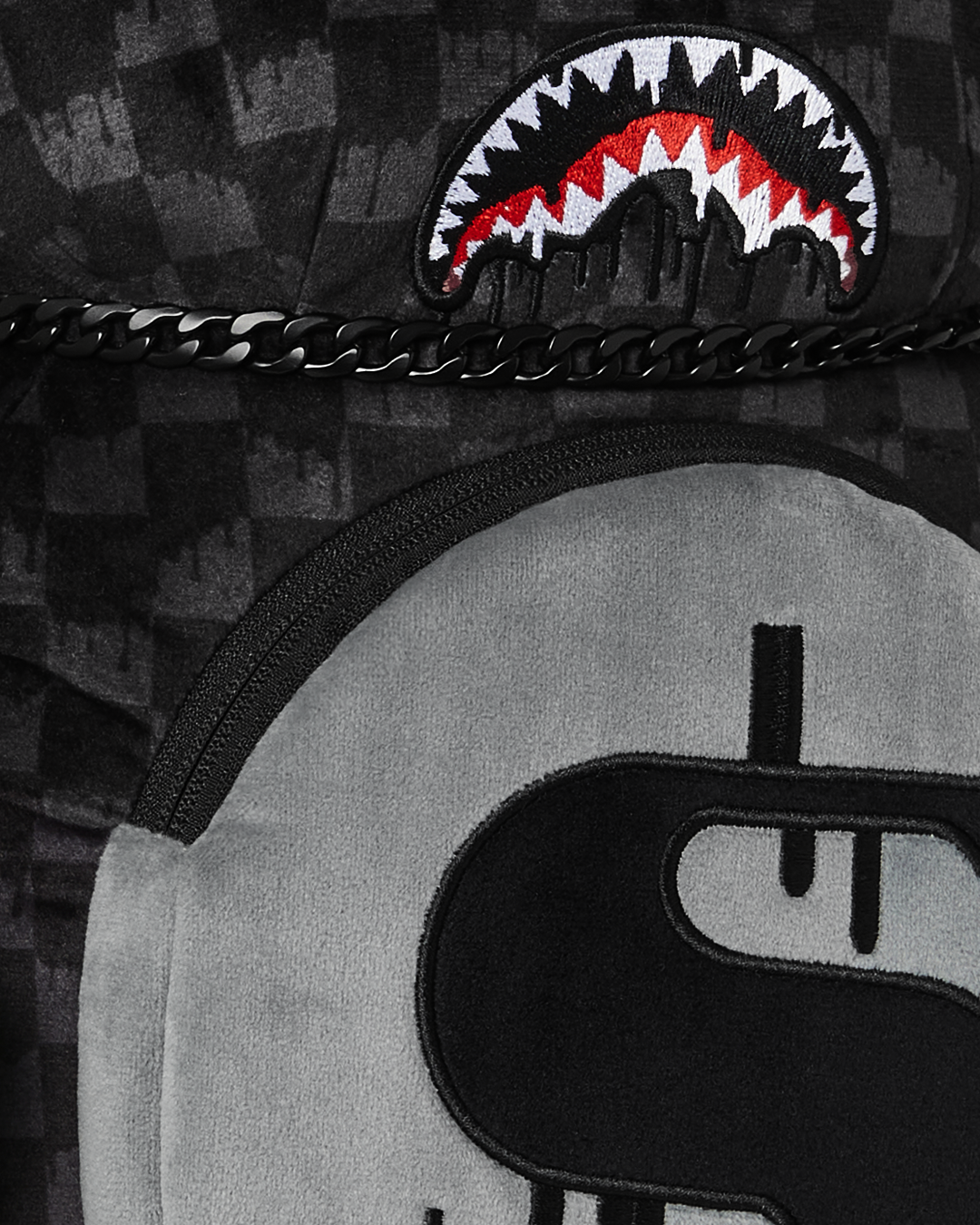 Front view of the plush teddy bear backpack with drippy shark mouth