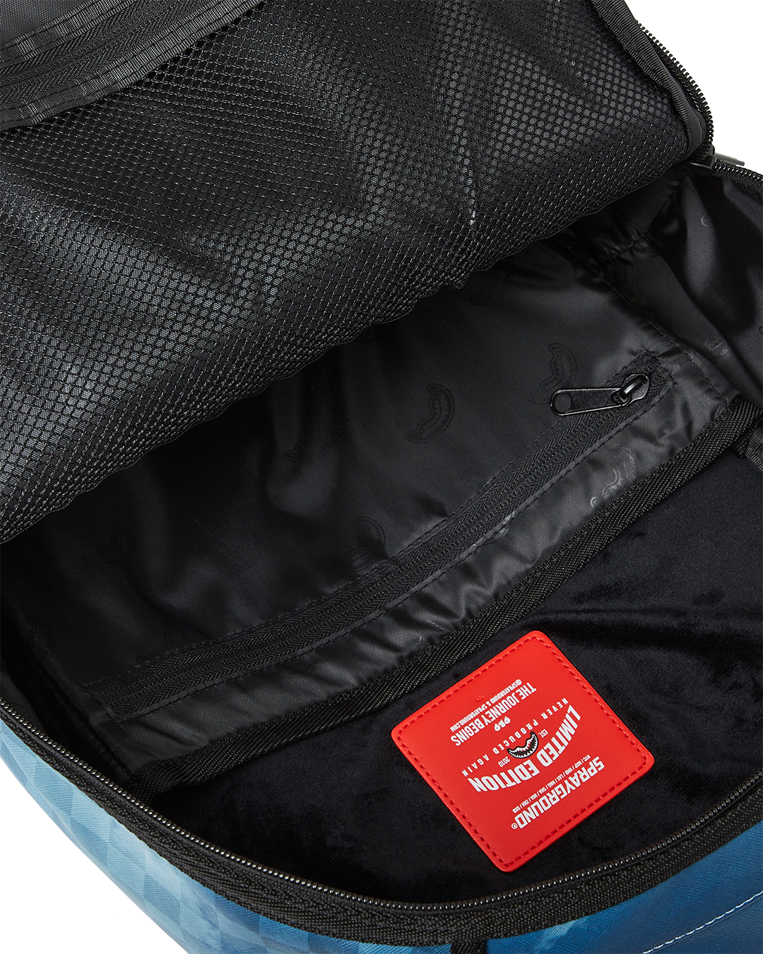 Front view of the mission impossible backpack showing bold 3D logo design