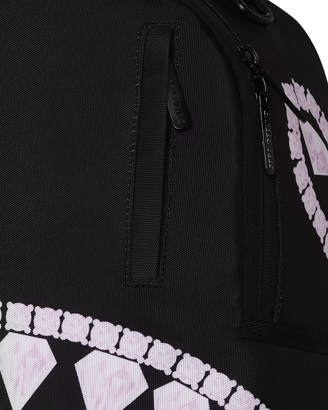 Open interior revealing the laptop compartment and organizer pockets in this Sprayground limited edition backpack