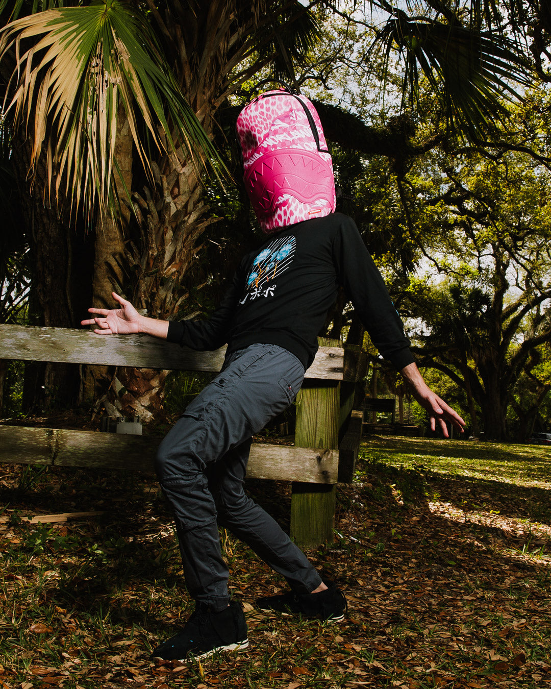 Faux Leather Shark Mouth Backpack being used as a travel companion with luggage