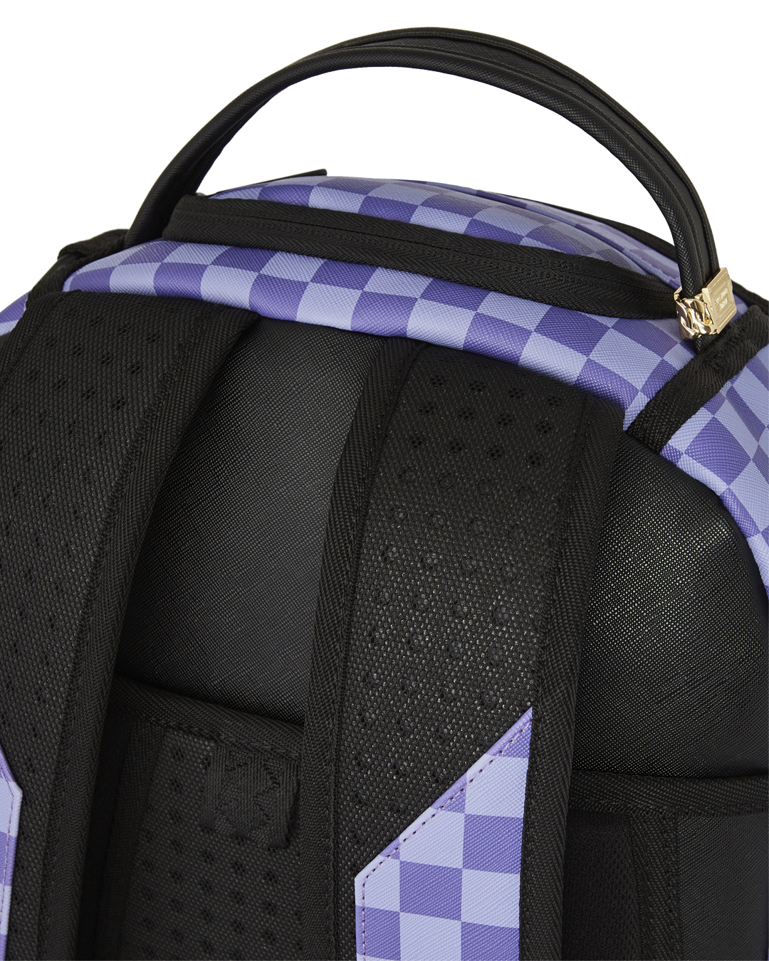 Front view of Sprayground Rugrats backpack showing Reptar and gold zipper details.