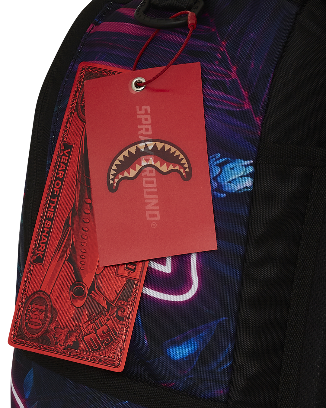 Backpack sliding onto luggage handle, perfect for airport travel