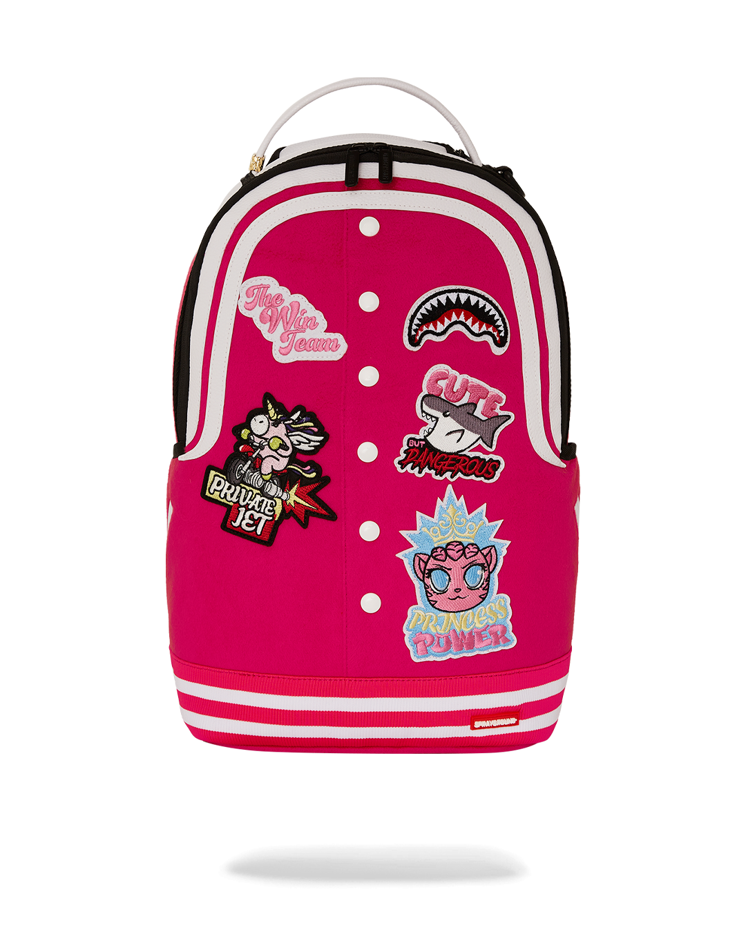 Winning Team backpack worn by a woman at an airport, attached to luggage handle