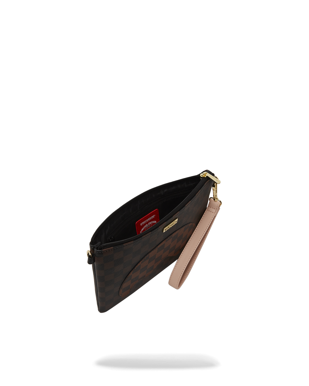 Lifestyle shot of purse wristlet being held during a city night outing