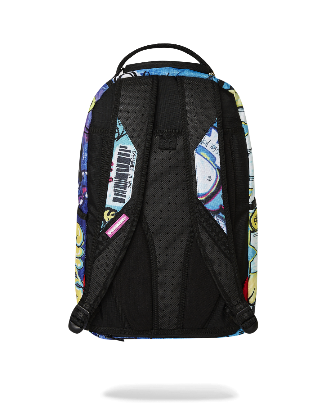 Close-up of the backpacks front zipper pocket and gold hardware for travel organization