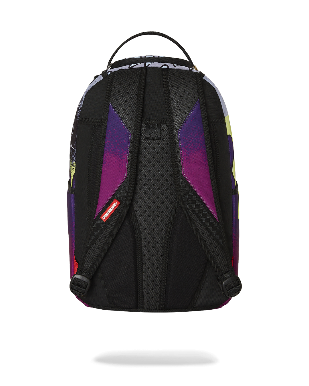Daybreak Luxe backpack in a travel setting, attached to luggage.