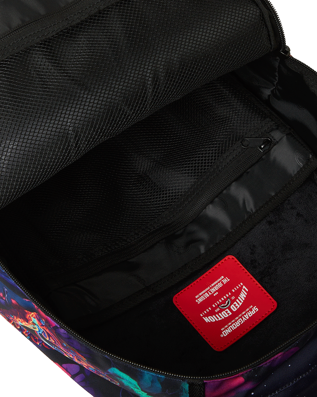 Side pocket of the EarthBound Luxe Travel Backpack holding a water bottle.