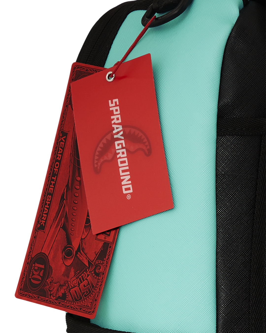 Shark Central backpack open, displaying interior velour laptop compartment and organizer pockets.