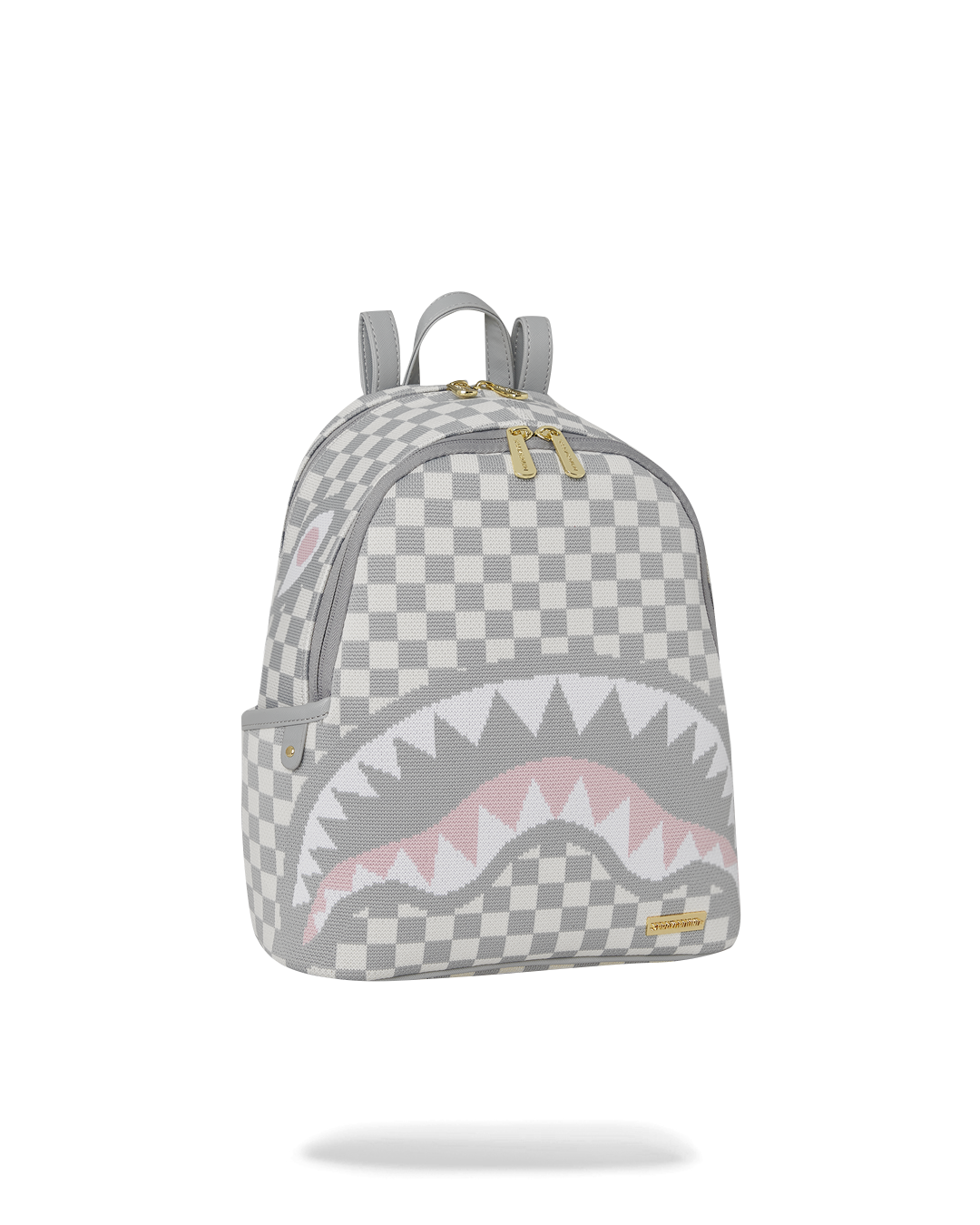 Side angle of the Savage Cream Sharks in Paris Backpack with adjustable straps.