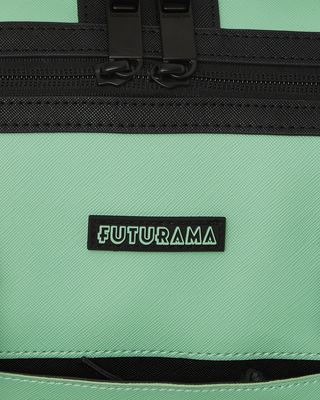 Close-up of the duffle bags metal zipper pocket and character designs on the side, showcasing its premium features.