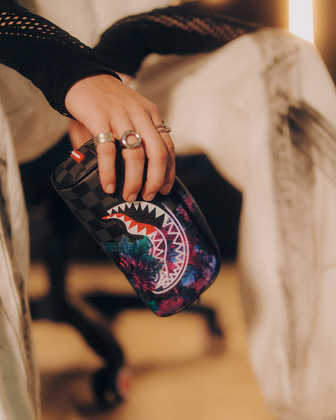 Pouch styled in a backpack with other daily essentials