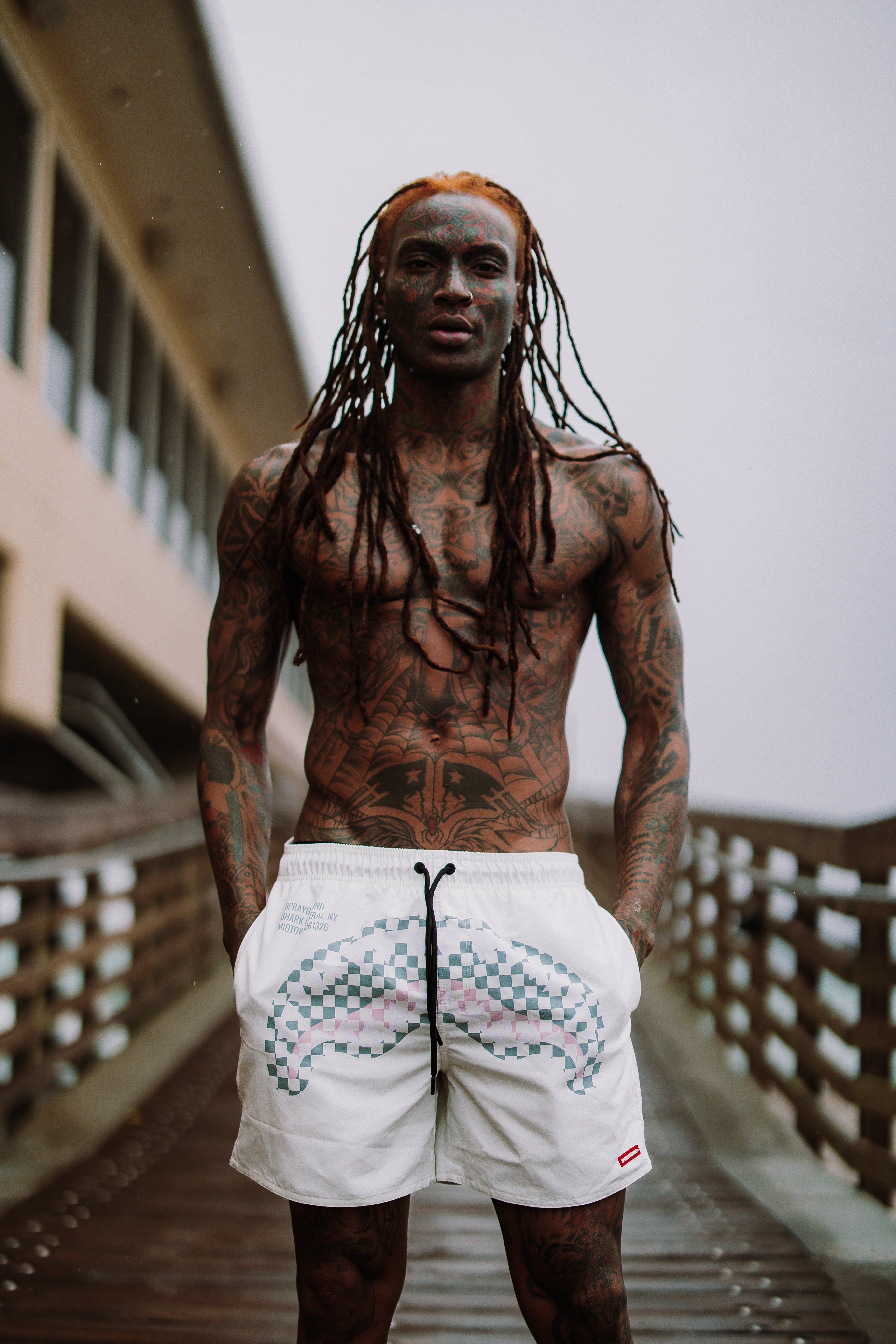 Mens swim shorts featuring a comfortable elastic waistband and side pockets.