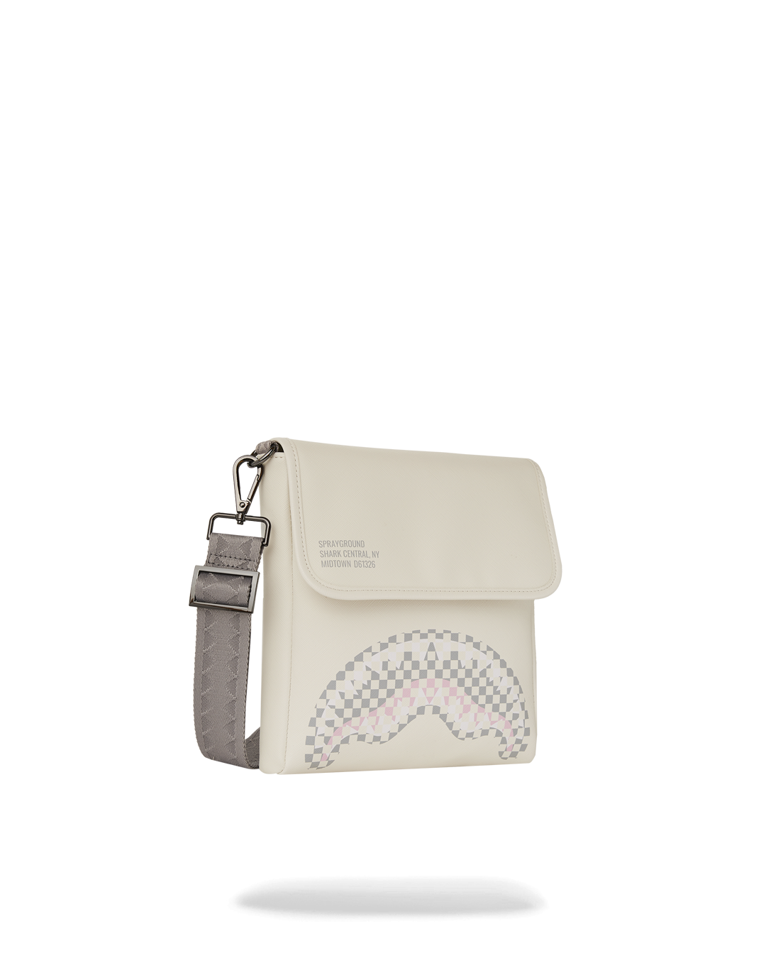 Close-up of faux leather crossbody bag in natural outdoor lighting