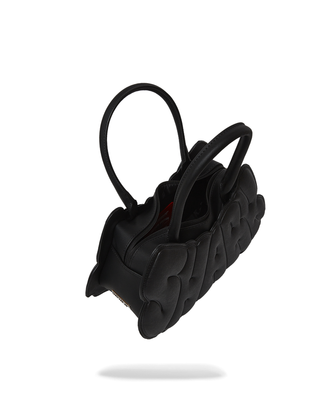 Side profile of the vegan handbag with soft handles and chain detail, ideal for daily wear