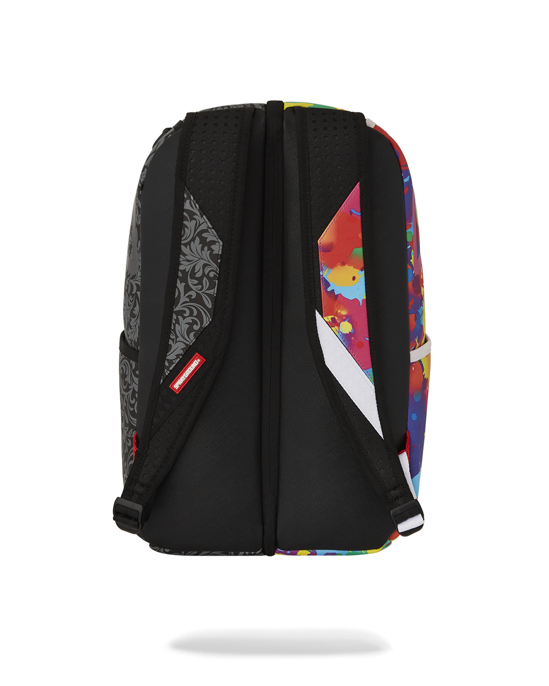 Two separated mini backpacks laid flat, highlighting interior mesh pockets