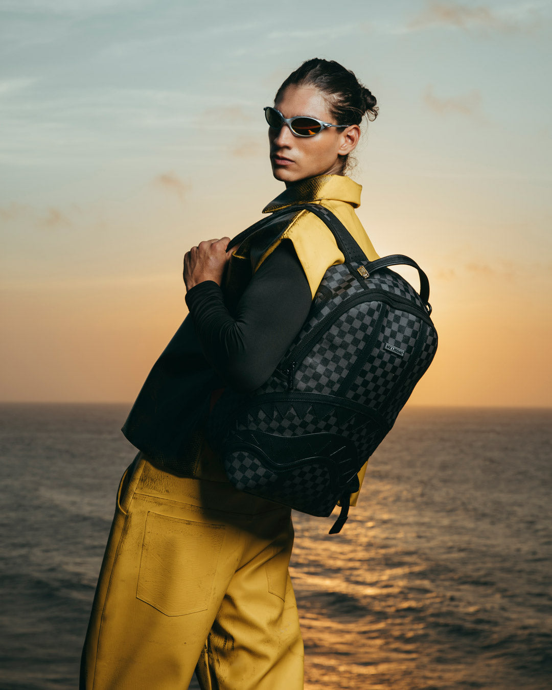 Close-up of faux leather texture and gold zipper details