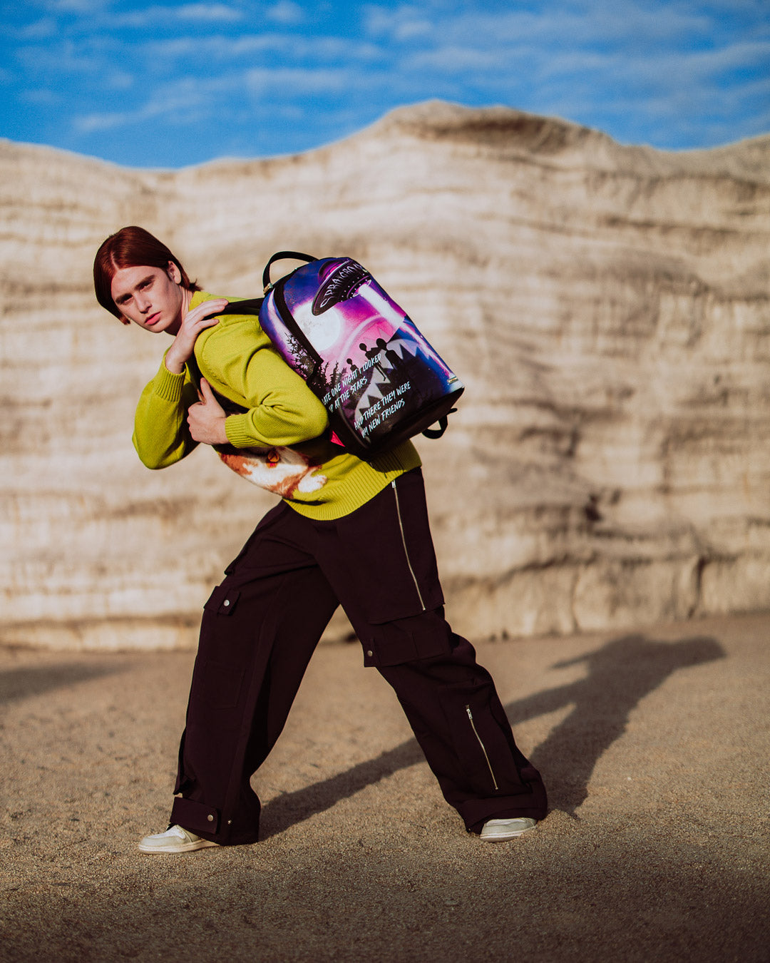Side view of travel backpack with ergonomic straps and carry-on sleeve