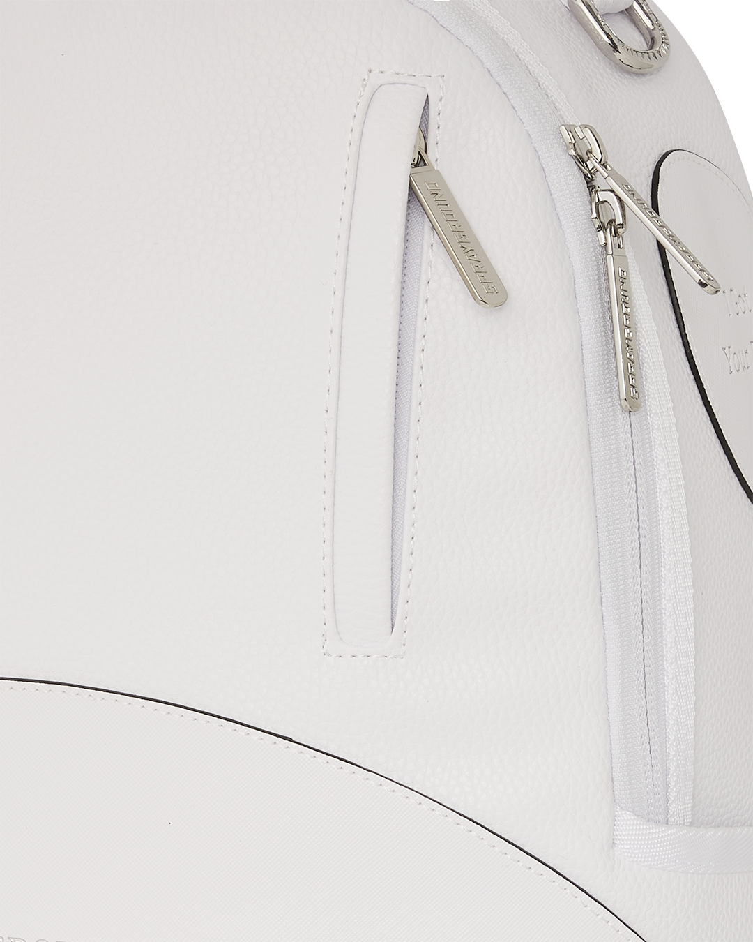 Side view of faux leather backpack with ergonomic straps and back sleeve for luggage.