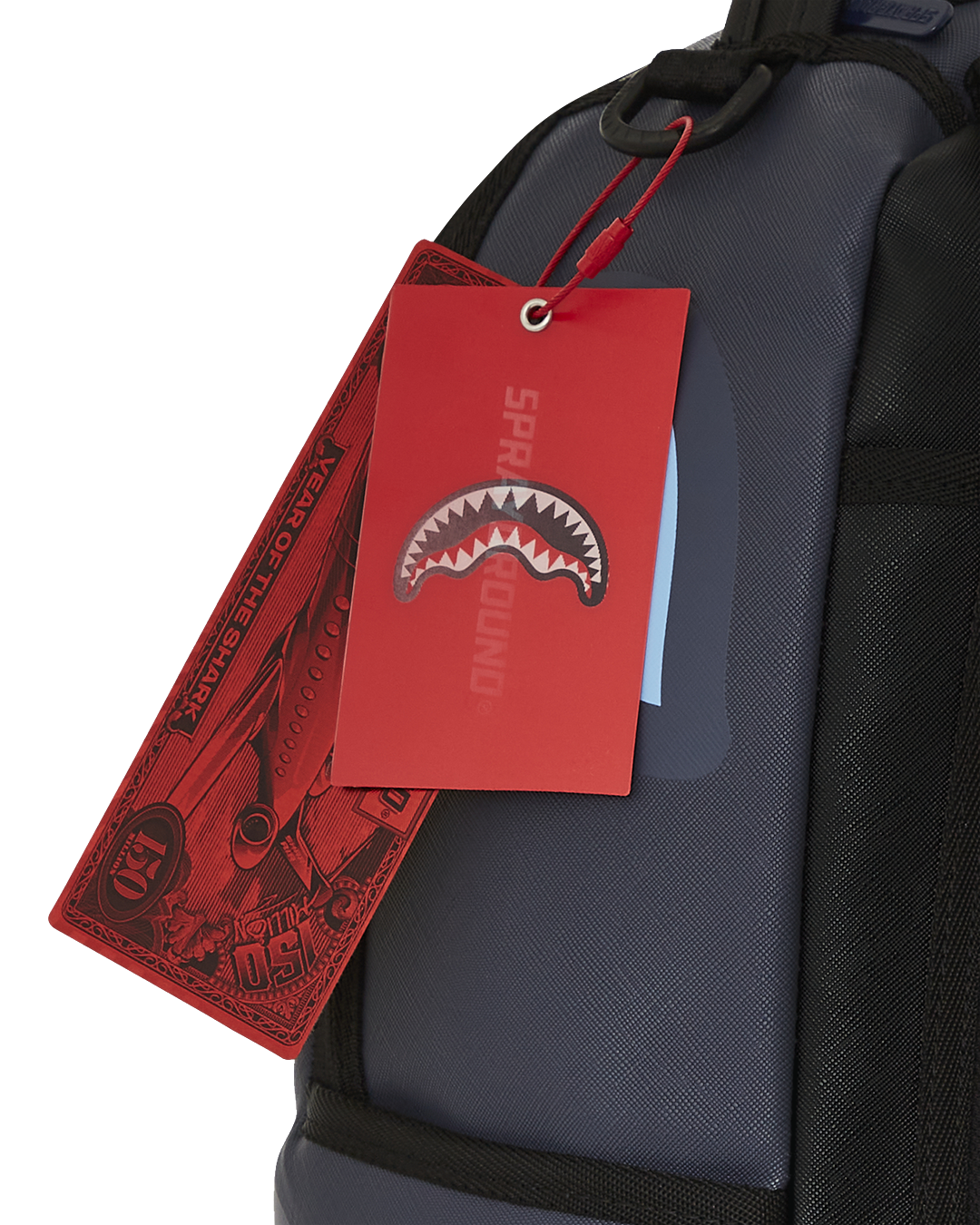 Open faux leather backpack displaying interior compartments and laptop sleeve.