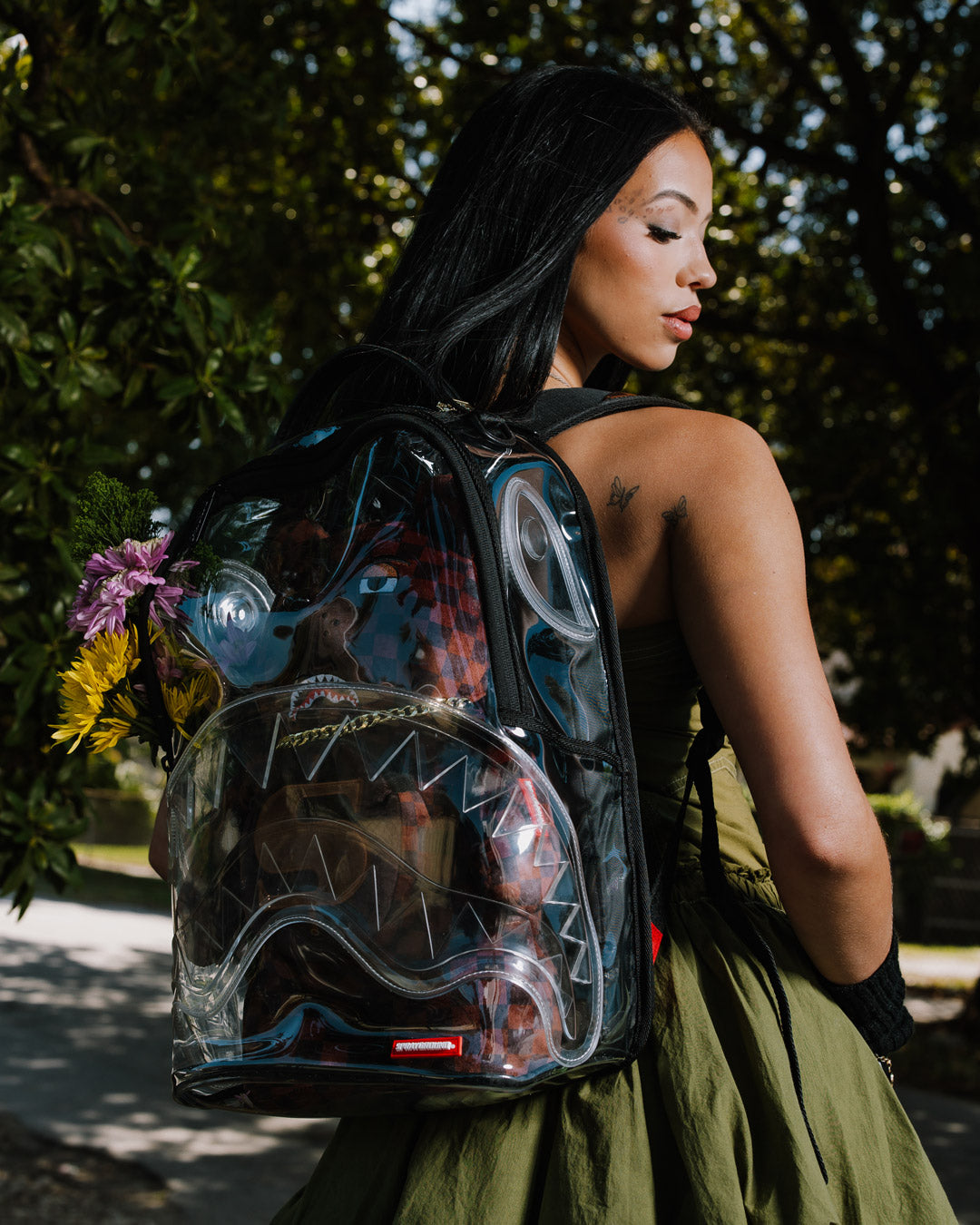 Side profile highlighting side pockets and adjustable straps for comfort