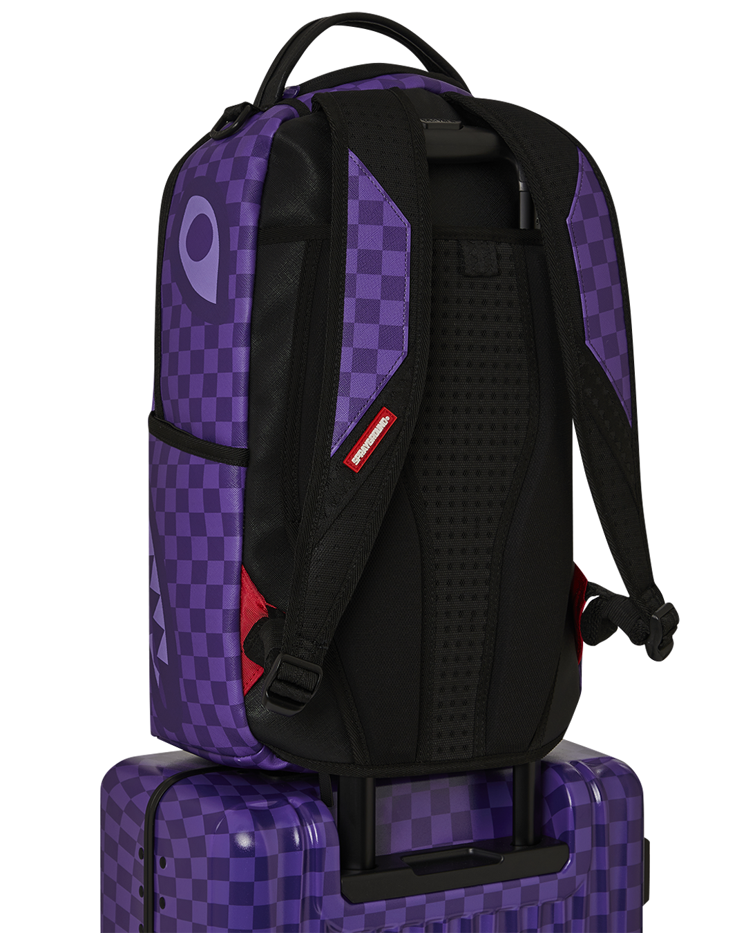 Interior of Sprayground carry-on luggage with multiple pockets and compression straps