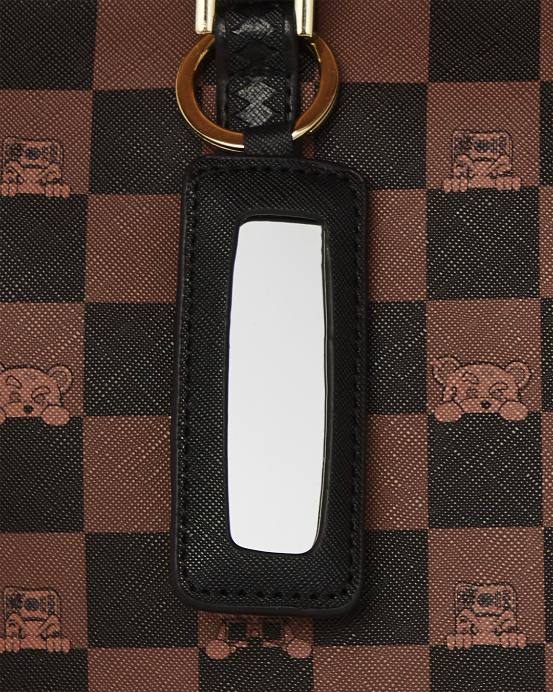Top angle of coach teri shoulder bag showing zipped opening and double handle