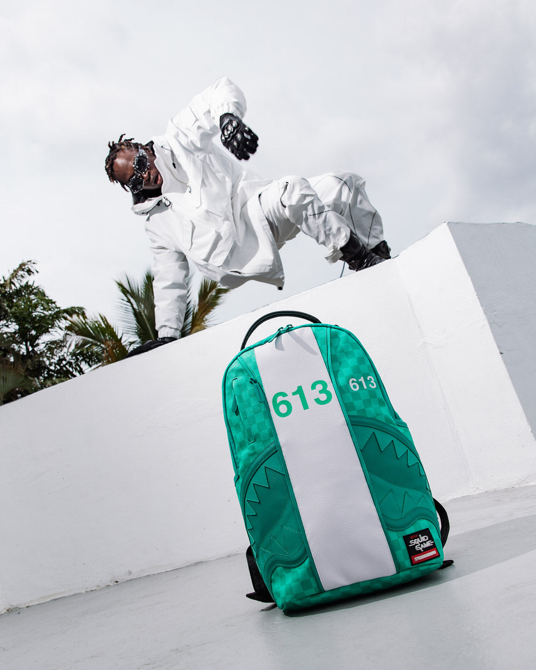 Sharkmouth jumpsuit backpack showcasing front and side pockets, perfect for travel.