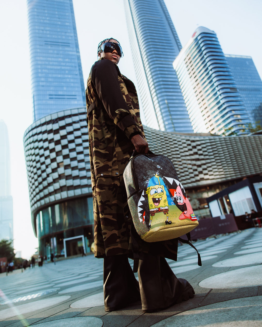 SpongeBob Bubble Frenzy backpack with gold zippers and side pockets.